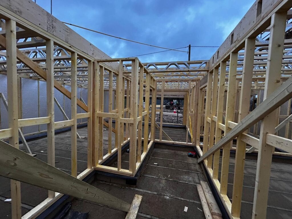 Timber frame building with insulated floors and walls