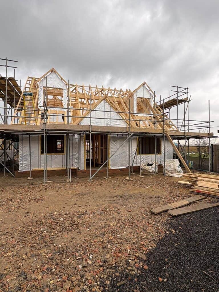 Timber frame building with insulated floors and walls