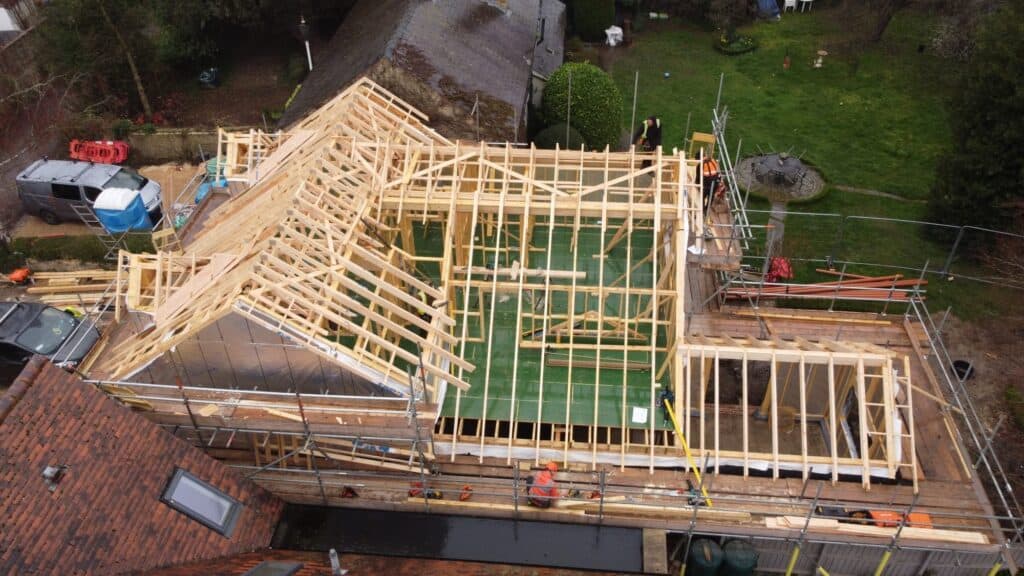 A timber frame building being constructed, truss detail