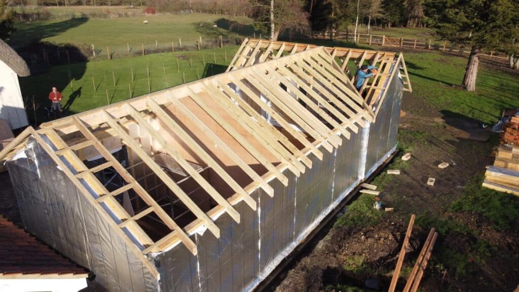 A timber frame bungalow being constructed