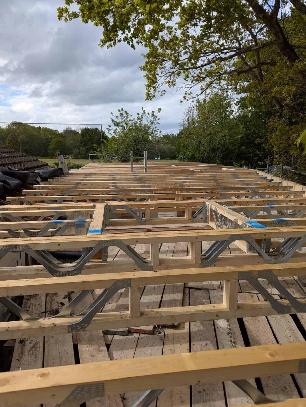 A timber frame building being constructed with Posi-Joists