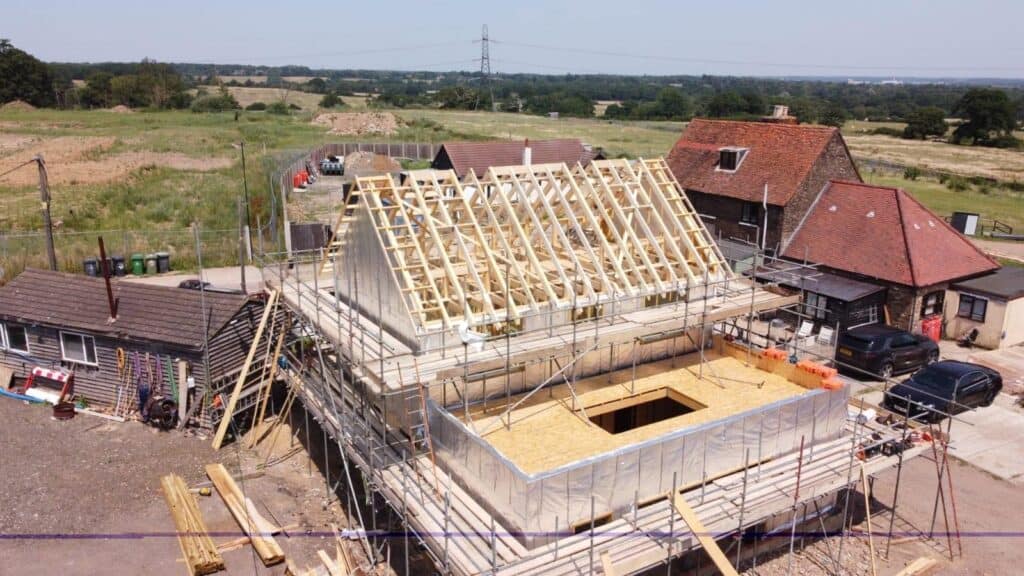Timber frame building with Posi-Joists and roof trusses