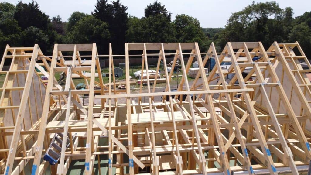 Timber frame building with Posi-Joists and roof trusses