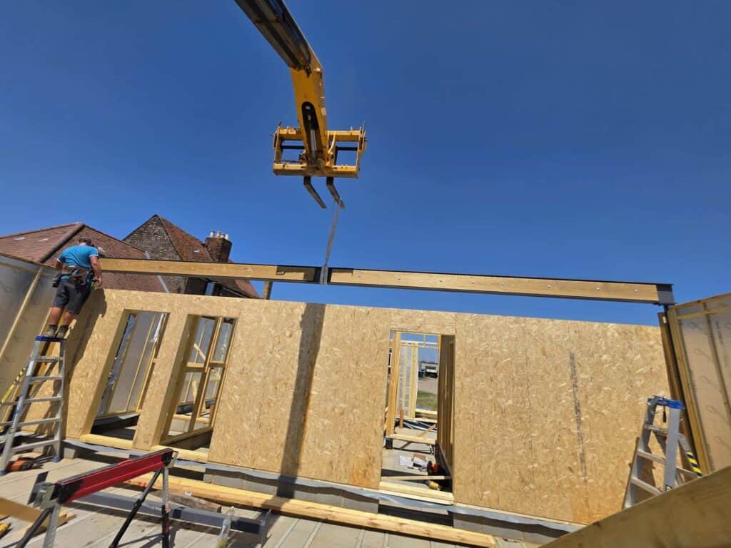 Timber frame building being erected