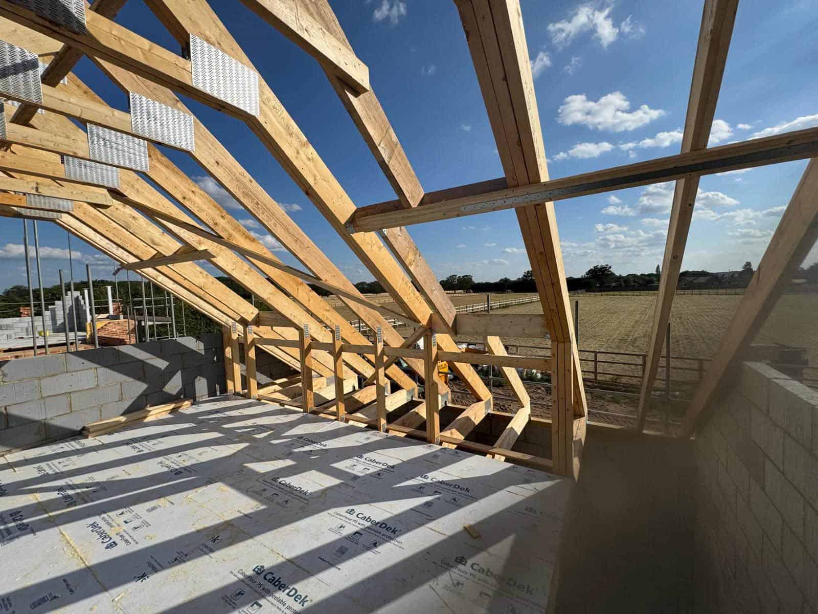 Timber trusses being installed