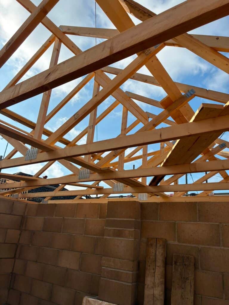 Timber trusses being installed