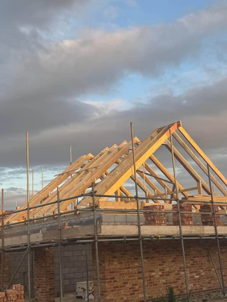 Timber trusses being installed
