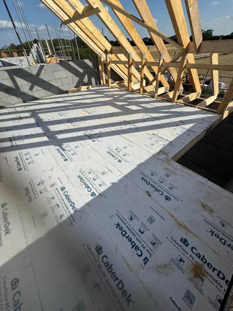 Timber trusses being installed